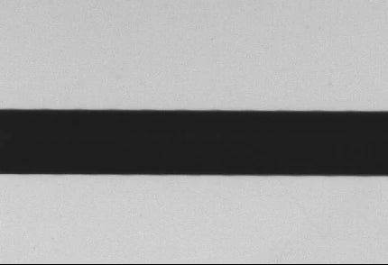 Original collimated-panel side: dimmer background and a more distinct outline boundary.