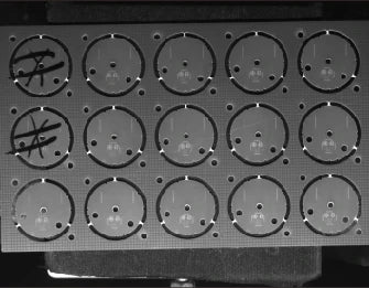 Same application sheet with the arc bar; repeated round outlines remain clearer across the field.